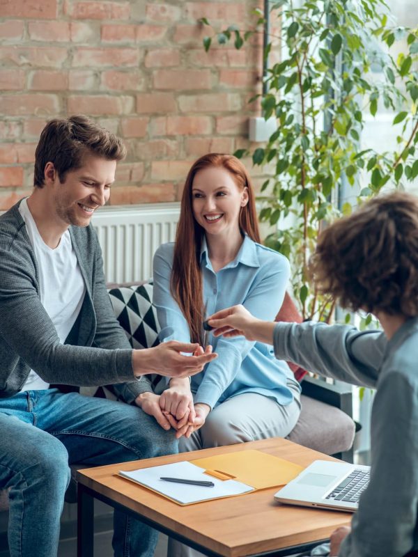 broker-giving-buyer-real-estate-key-1.jpg