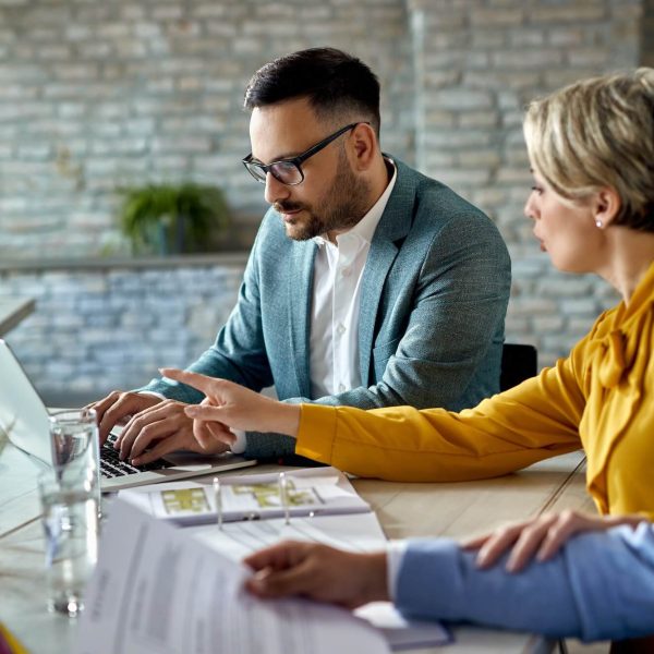 real-estate-agent-using-laptop-while-having-a-meeting-with-a-couple-in-the-office-1-1.jpg real-estate-agent-using-laptop-while-having-a-meeting-with-a-couple-in-the-office-1-1.jpg